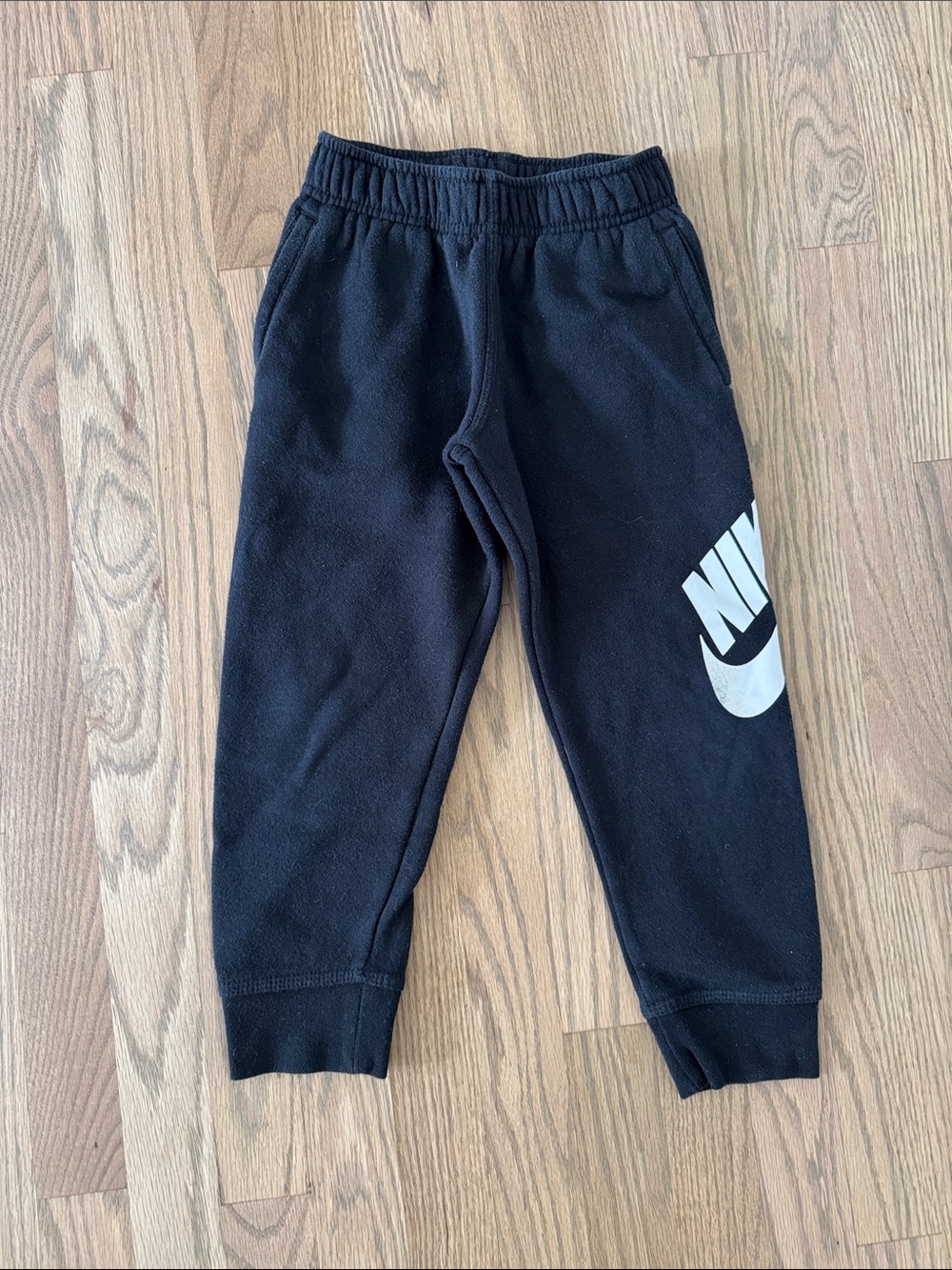 Nike Black Joggers with White Swoosh Graphic